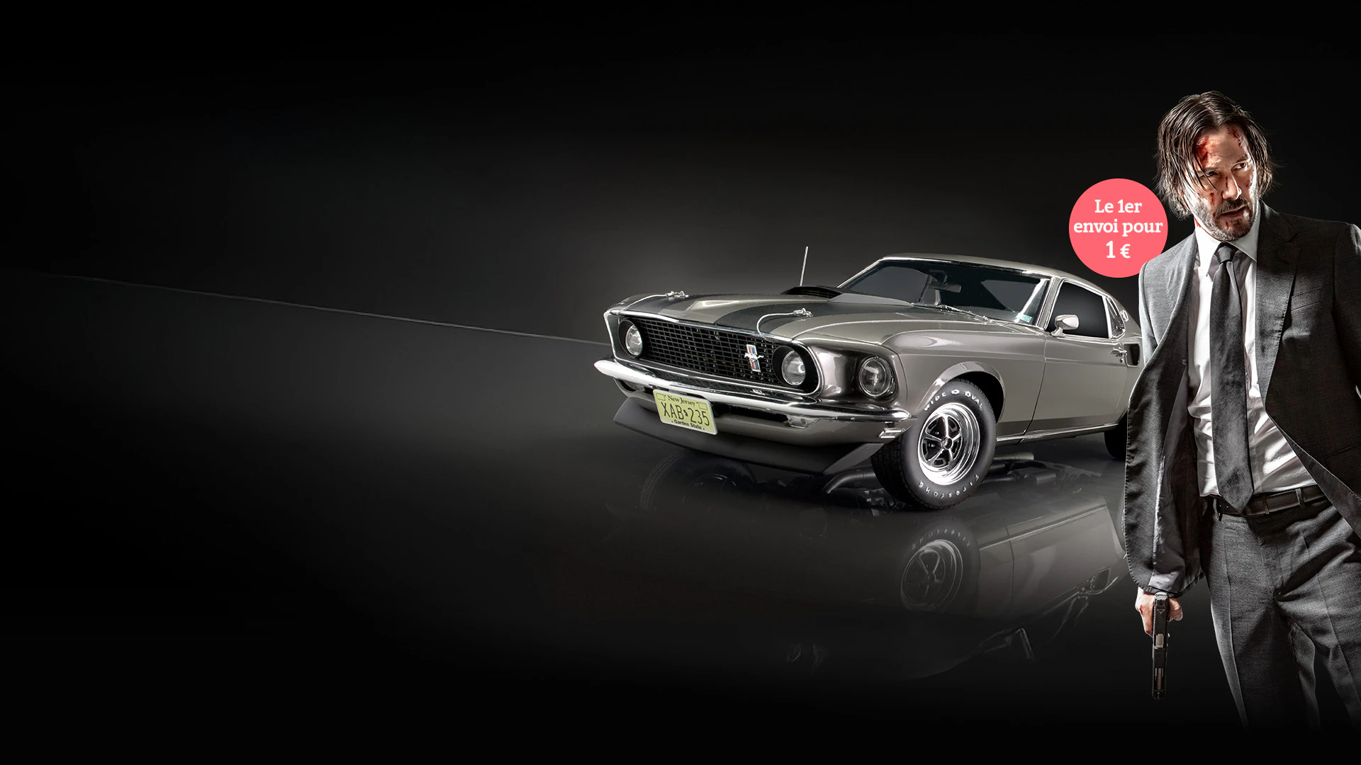 Image d’une voiture gris/argent sur fond sombre. À côté, image de l’acteur Keanu Reeves. L’image inclut le texte promotionnel : « Le 1er envoi pour 1€ ».